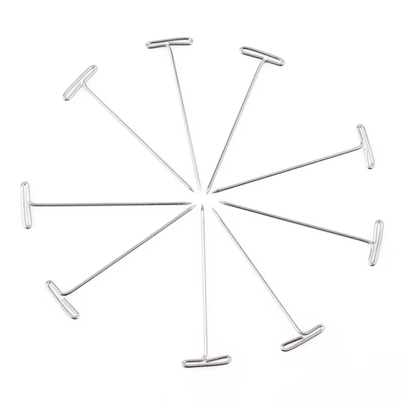 Stainless steel T-pins for wig making and knitting, arranged in a starburst pattern.