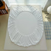 A white adjustable fitted bed sheet cover is displayed on a white surface.