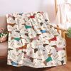 A patterned flannel blanket featuring cute dog illustrations and paw prints.