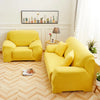 A bright yellow faux silk sofa cover is displayed in a modern living room setting.