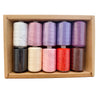 A box containing ten colorful polyester sewing thread spools arranged in a row.