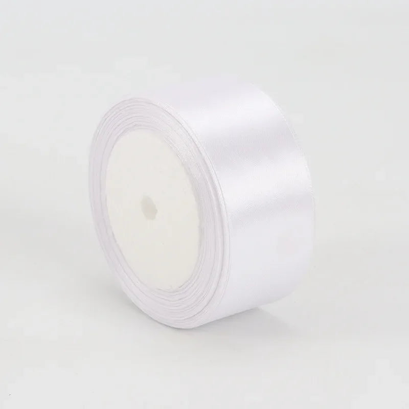 A roll of white satin ribbon measuring 4cm for crafts and gift wrapping.