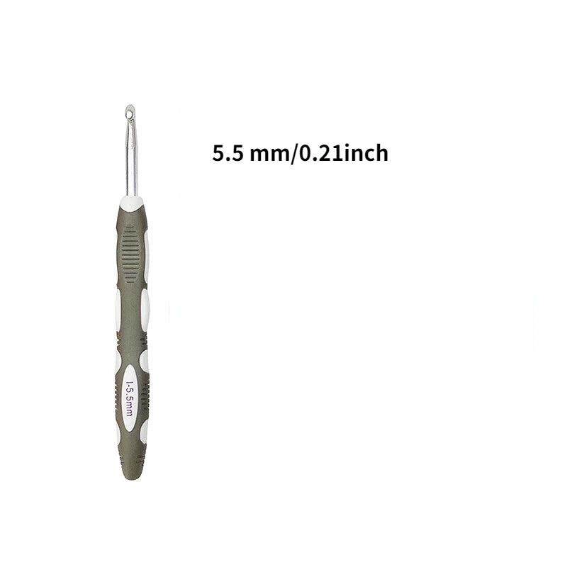 A close-up view of a silver ergonomic crochet hook and needle set.