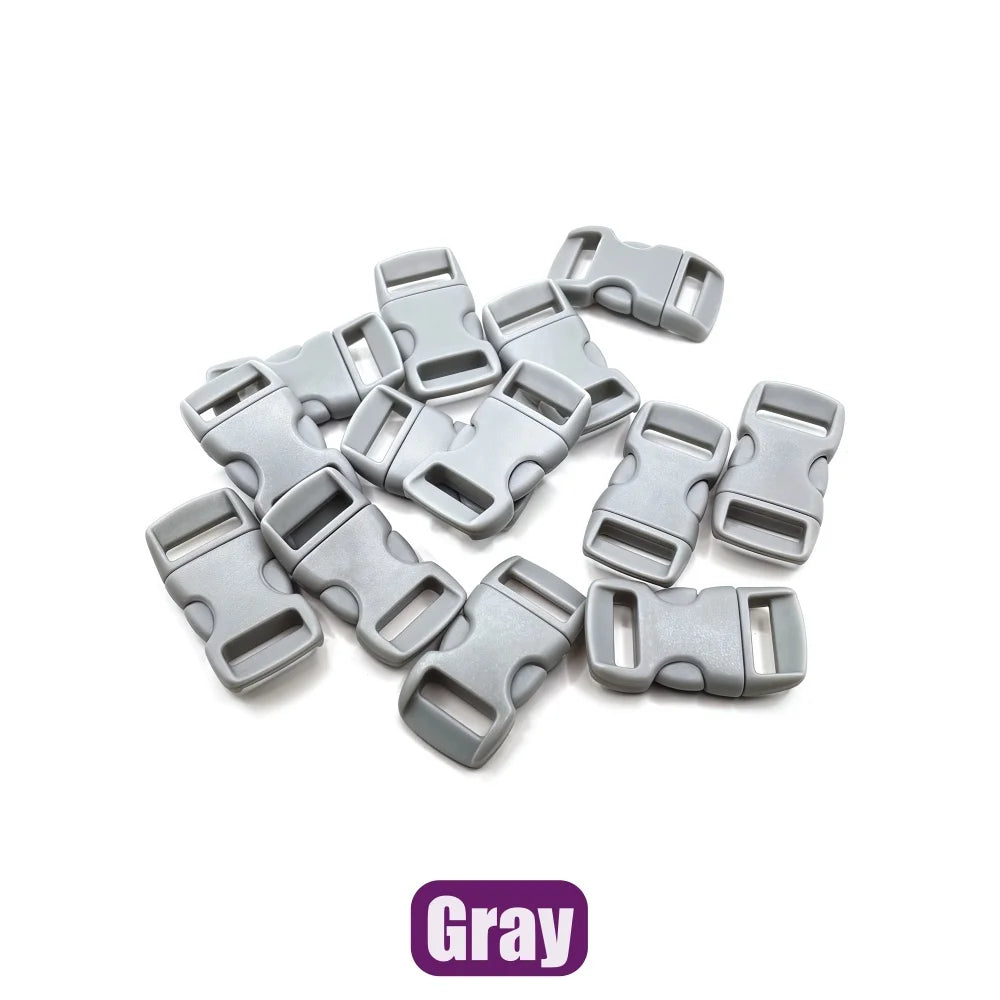 A collection of gray adjustable plastic paracord buckle bracelets.