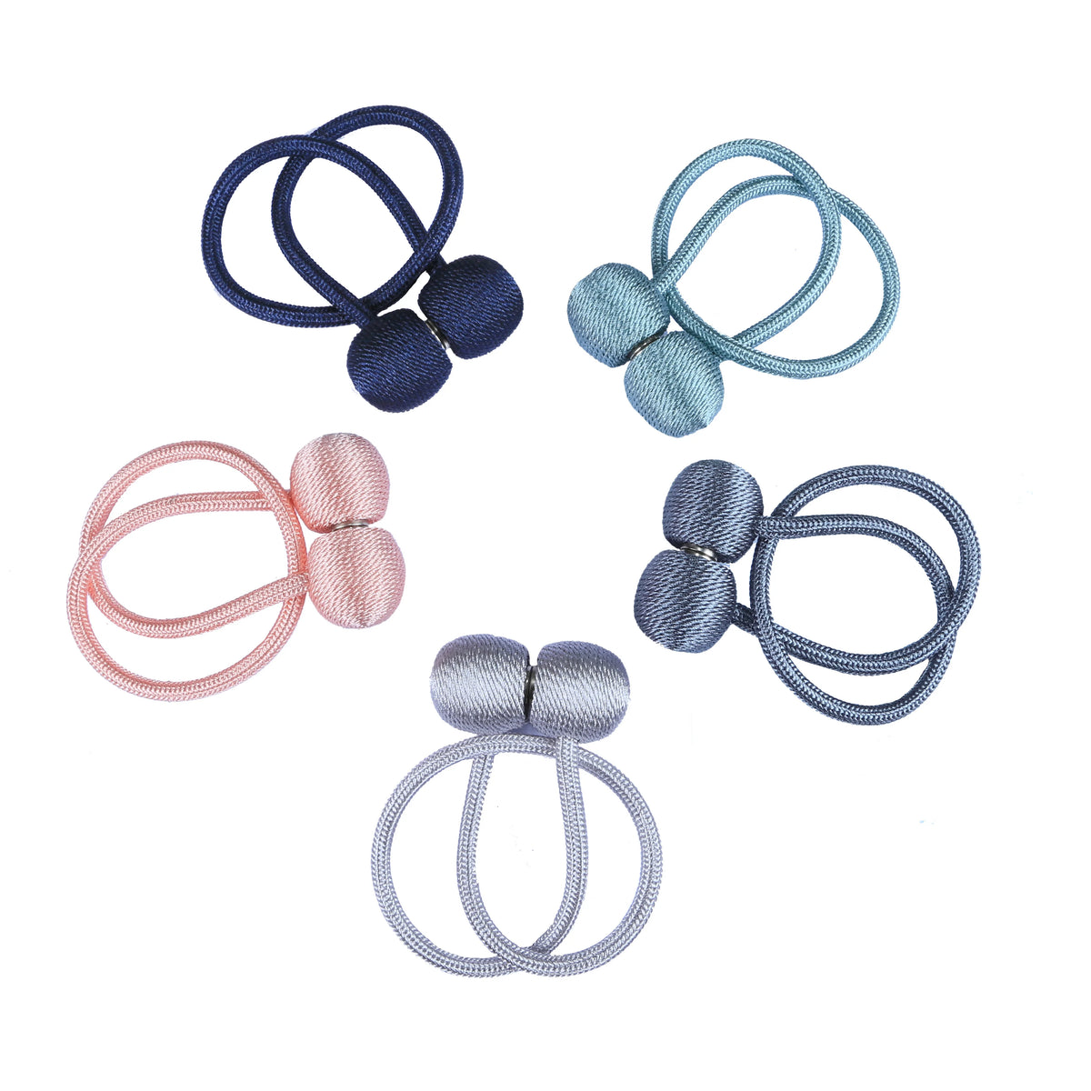 A collection of magnetic curtain tiebacks in various shades of blue, pink, and gray.