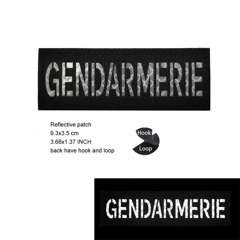 Black embroidered patch with the word GENDARMERIE in silver thread