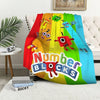 A colorful throw blanket featuring cartoon characters and the text Number Blocks.