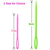 A pair of bright green plastic sewing needles with large eyes shown next to a pink version.