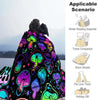 A colorful mushroom flannel throw blanket displayed against a snowy mountain landscape.