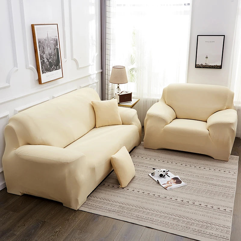 A cream-colored elegant faux silk sofa cover displayed in a bright room with natural light.