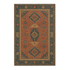 An antique-style area rug featuring intricate geometric patterns in shades of rust, blue, and gold.