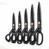 A set of twelve black heavy duty industrial tailor scissors arranged vertically.