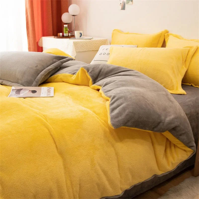A yellow and gray flannel duvet cover set displayed on a bed with orange curtains in a bright room.