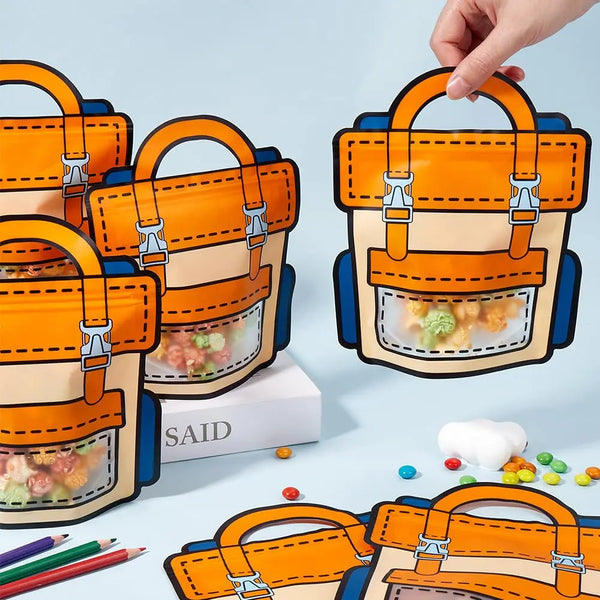 Orange and blue cartoon birthday party goodie bags with handles shown in various arrangements.
