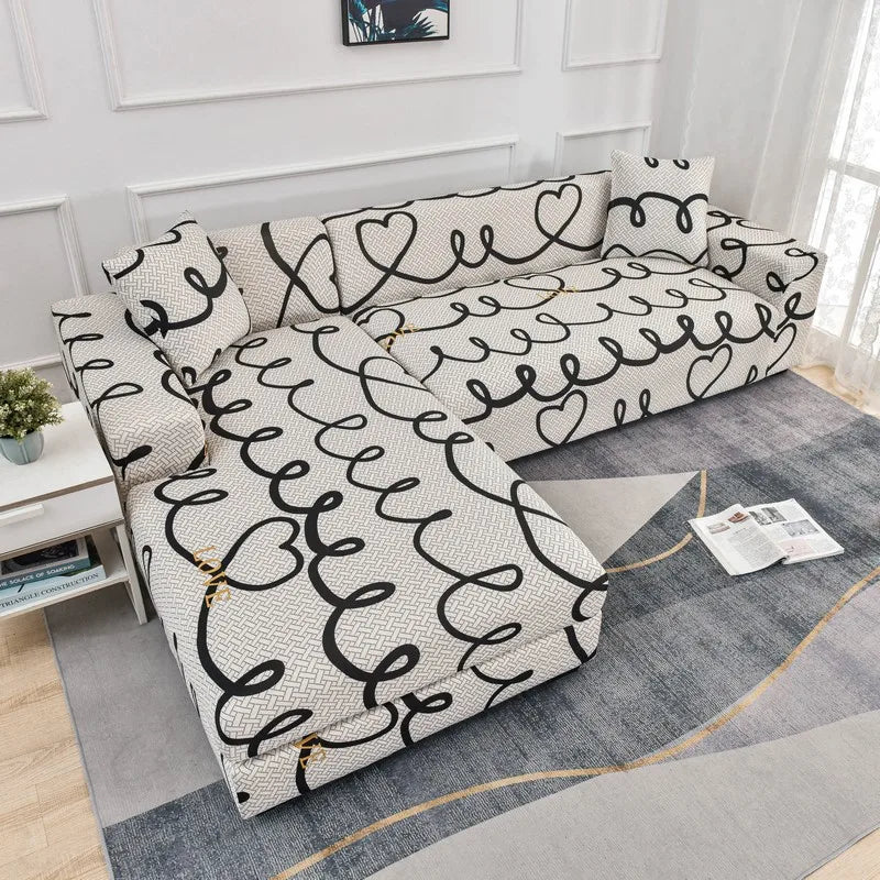 L-shaped sofa protector covers featuring a white and black wavy pattern on a gray fabric.