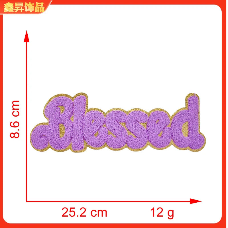 Purple embroidered patch with the word Blessed on a white background