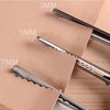 Close-up of professional dressmaking pinking shears with varying blade sizes marked 3mm, 5mm, and 7mm on brown paper.