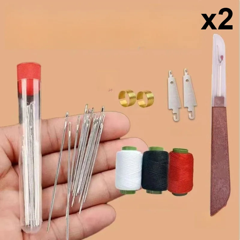 A hand sewing tool kit showing a glass needle, pins, and sewing needles alongside spools of thread and a sewing tool.