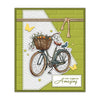 A vintage bicycle with a basket of fruit and flowers is depicted on a green background.