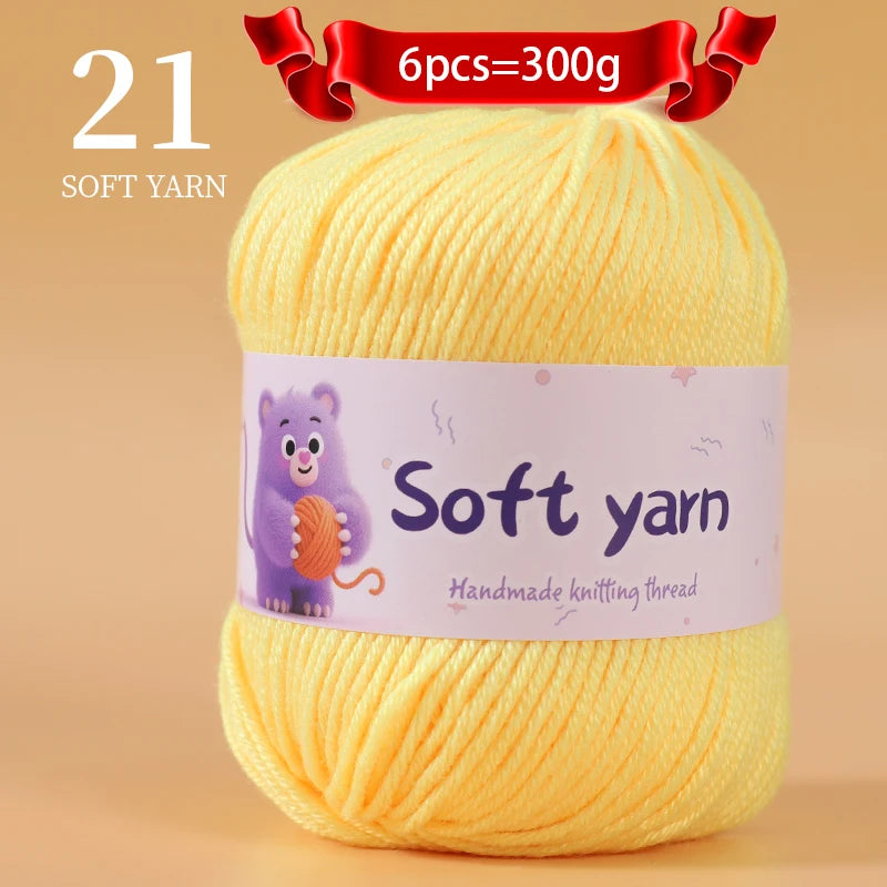 A ball of yellow soft yarn labeled as 21 strands, with a purple illustration on the tag.