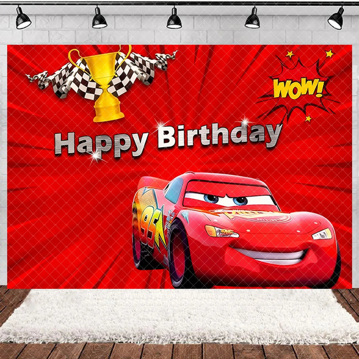 A vibrant birthday party backdrop featuring a cartoon race car, checkered flags, and bold text.