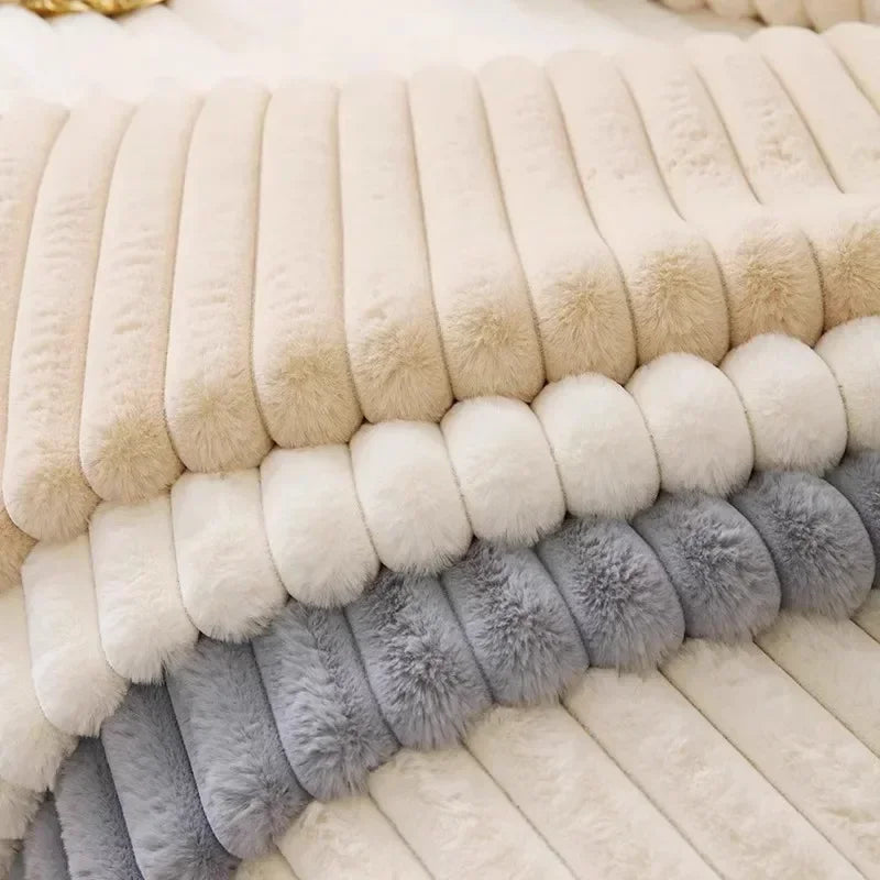 A close-up of a plush anti-slip sofa seat cushion cover featuring horizontal stripes in cream, beige, and gray faux fur.