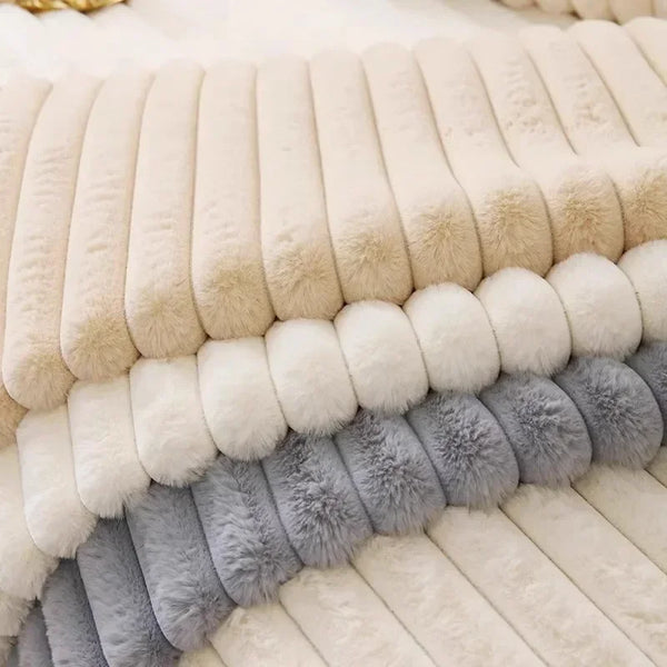 A close-up of a plush anti-slip sofa seat cushion cover featuring horizontal stripes in cream, beige, and gray faux fur.