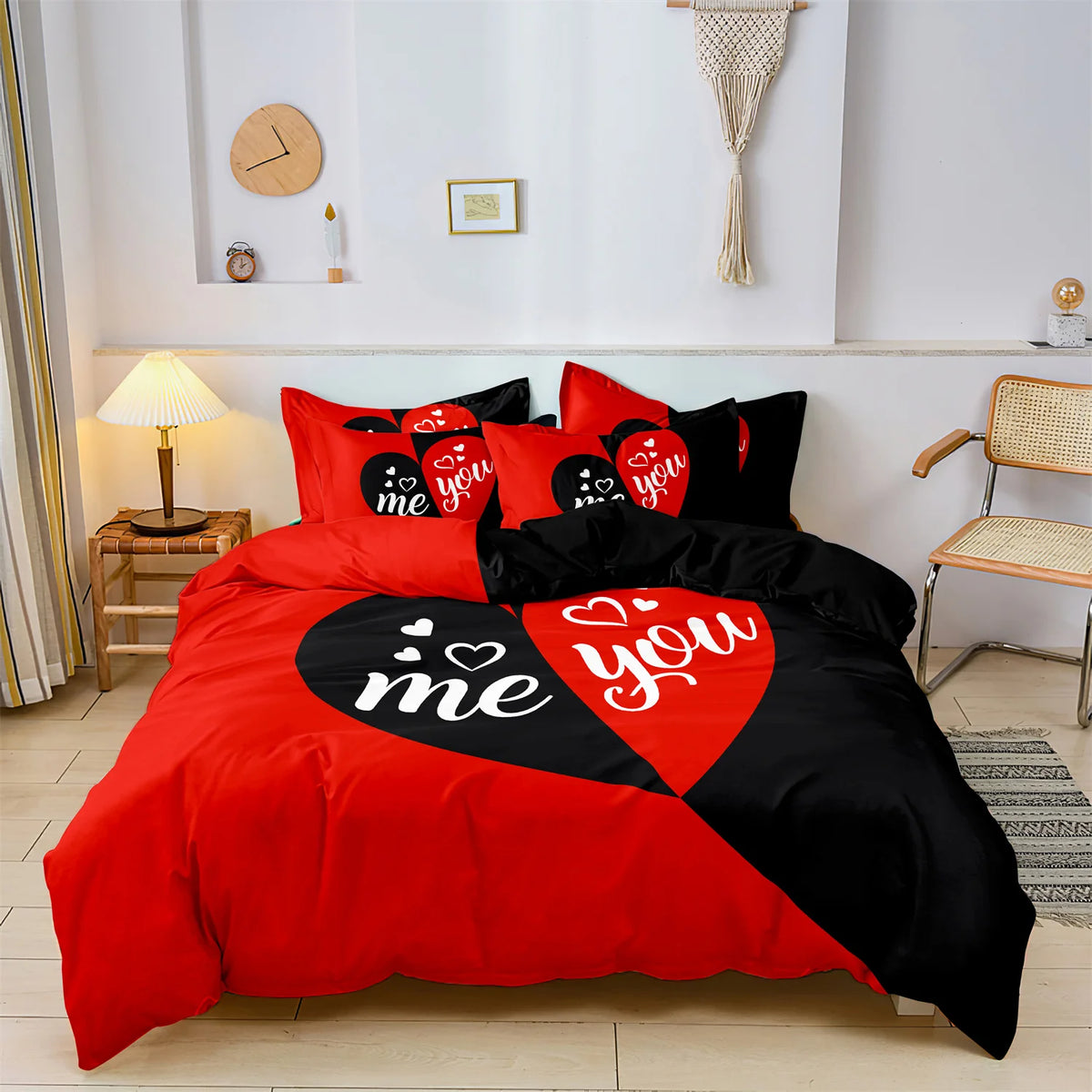A red and black printed letter bedding set spread on a bed with decorative wall elements.