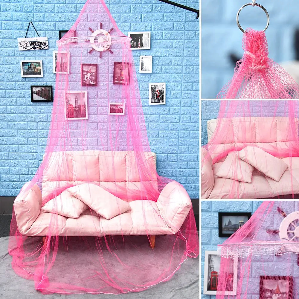 Pink lace dome mosquito net canopy draped over a bed, featuring decorative elements and pink fabric.