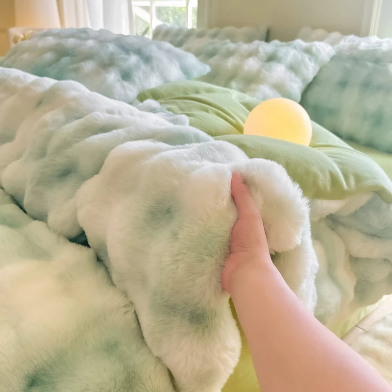 A hand touches a fluffy, light green and blue patterned fleece duvet cover with a yellow light source visible.