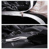 Close-up of a black duvet cover with a silver zipper and white piping, shown alongside fabric details.