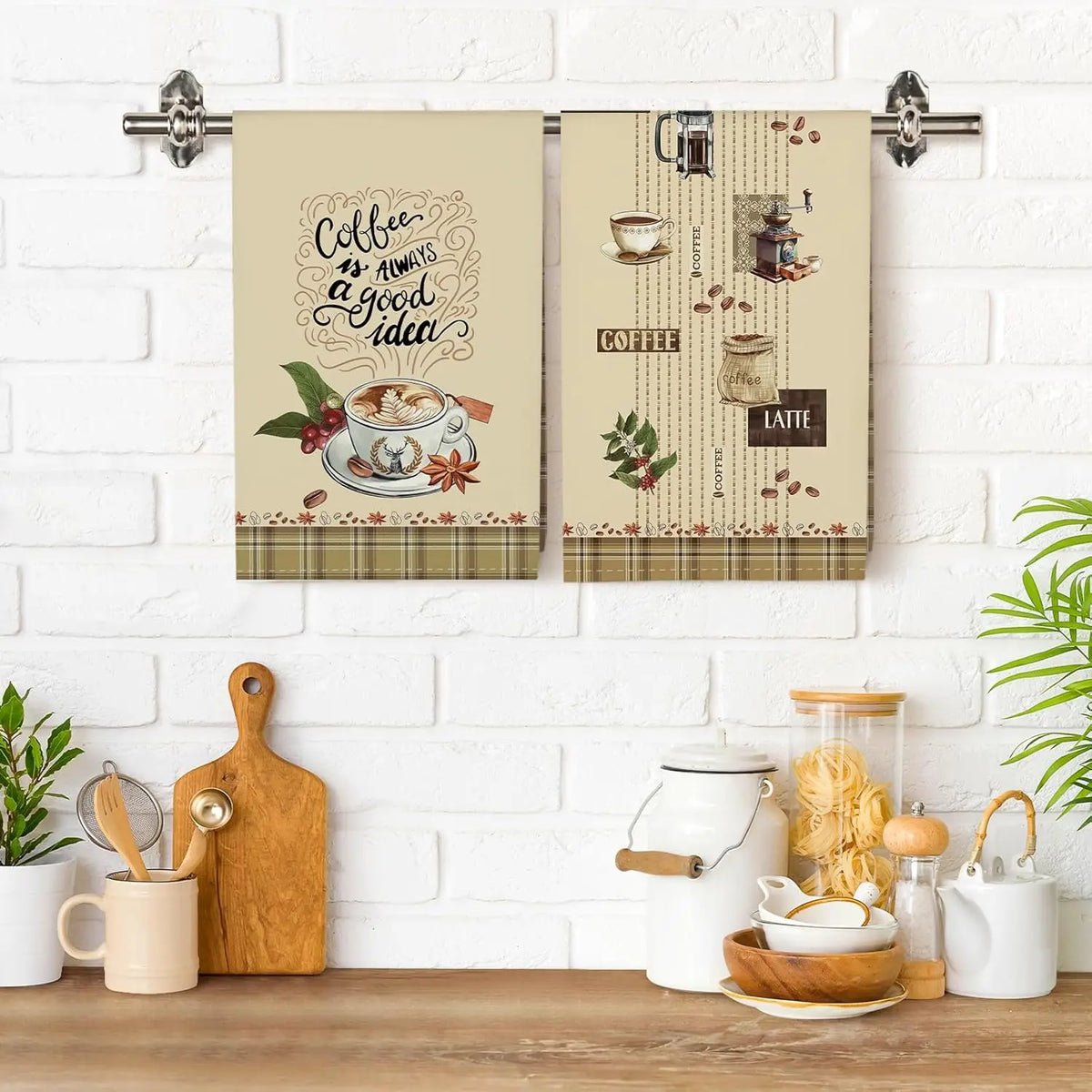 A set of four plaid lettered kitchen towels featuring coffee and latte designs.