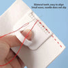 A hand is using a red needle to align bilateral teeth on a white template for a precision sewing guide kit.