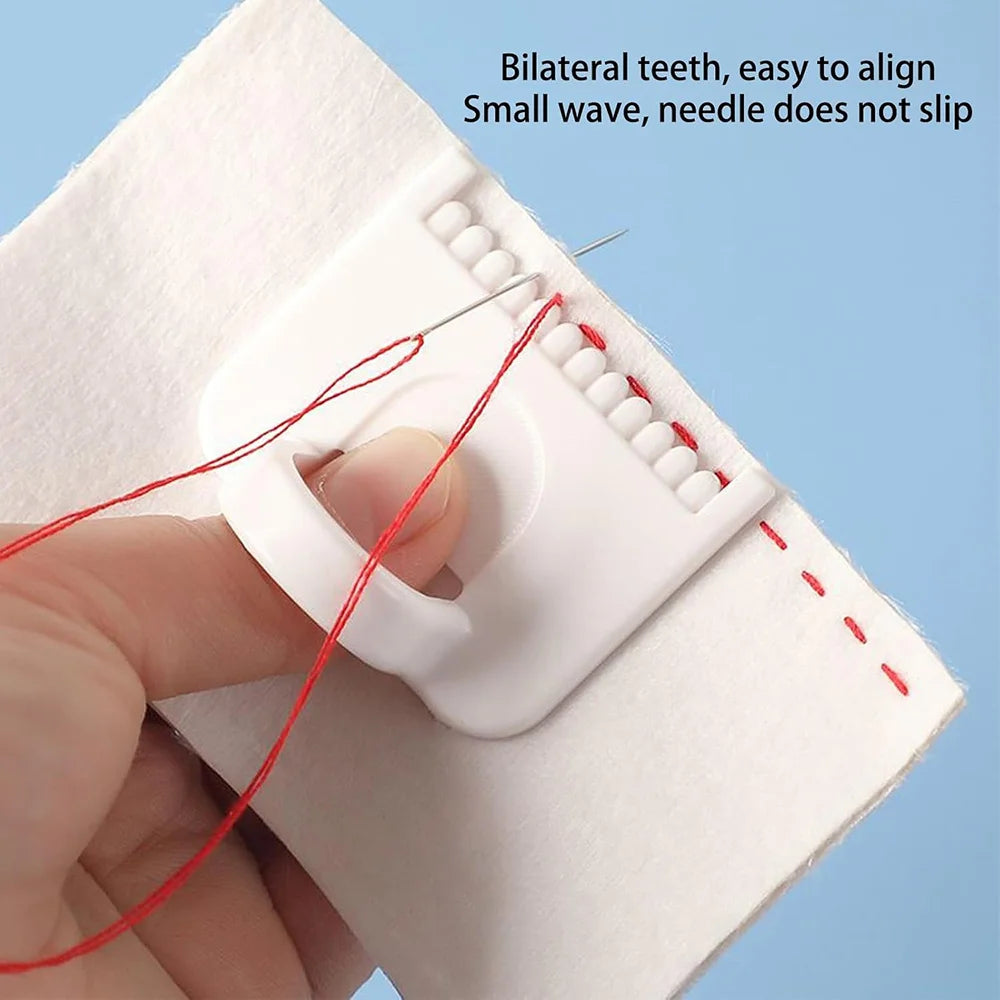 A hand is using a red needle to align bilateral teeth on a white template for a precision sewing guide kit.