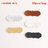 A random mix of five PU leather embossed tags in brown, white, and black colors for handmade crafting.
