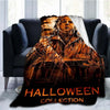 A Halloween collection throw blanket featuring a distressed Michael Myers horror character print.