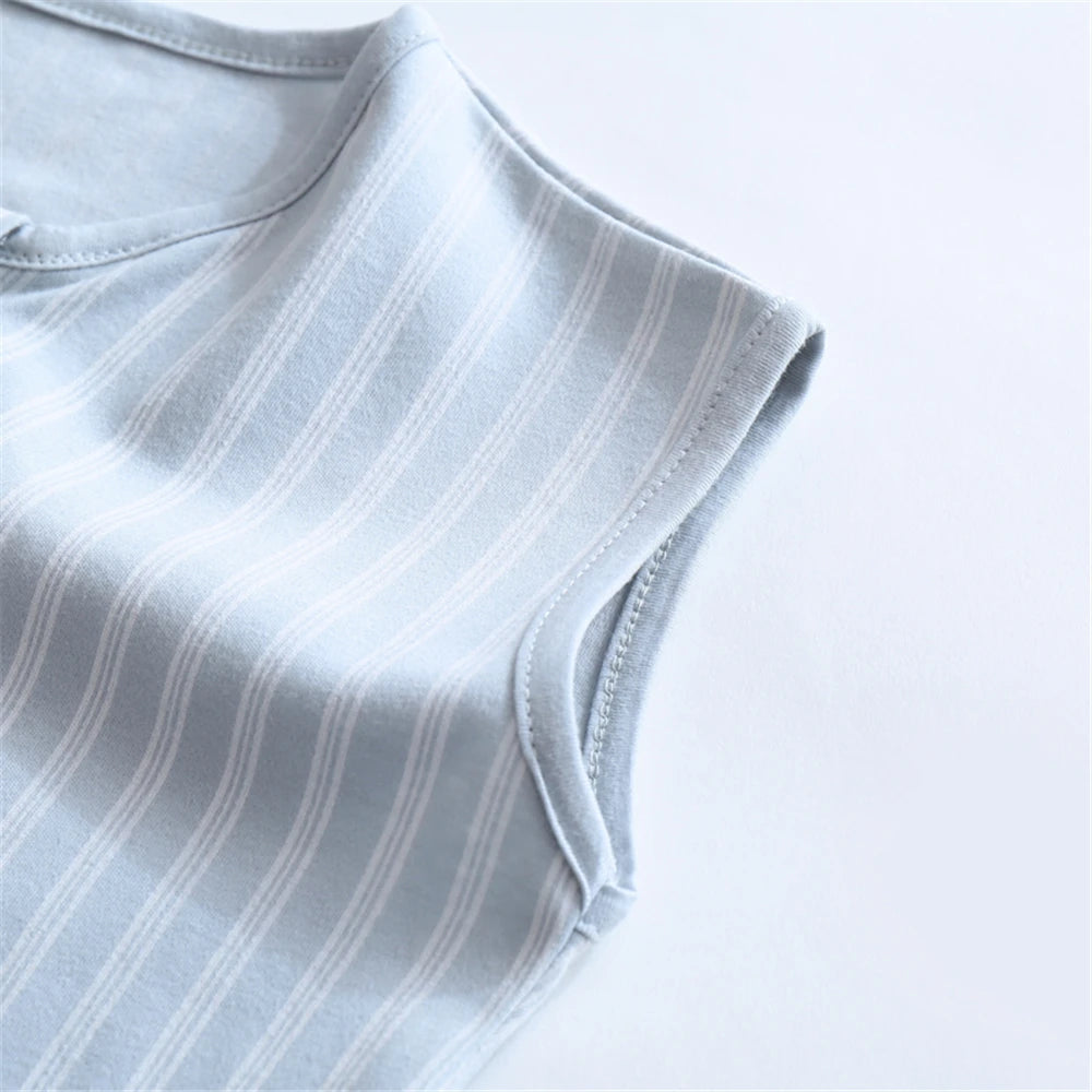 A close-up of a light gray cotton striped sleeping bag for children.