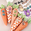 A collection of flower-shaped resin buttons adorned with colorful rhinestones and glitter.