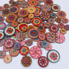 A collection of vintage wooden buttons in various colors and patterns arranged radially.