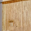 Golden sheer curtain with gold fringe and vertical strands covering a window.