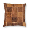 A square faux fur cowhide print cushion cover featuring a brown and tan checkered pattern.