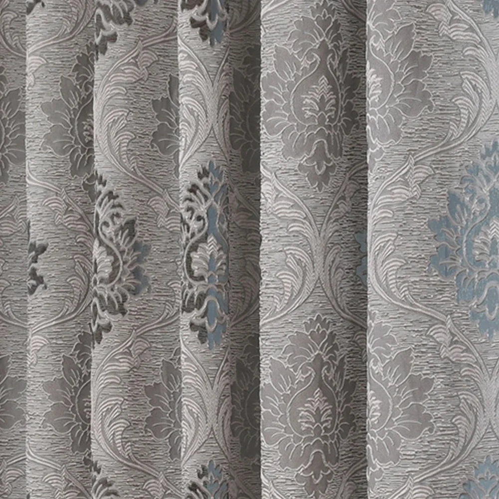 Gray sheer jacquard curtain panel featuring an ornate floral pattern.