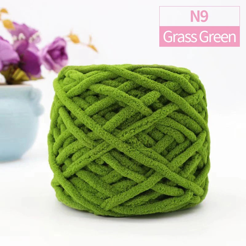 A ball of grass green chunky velvet knitting yarn labeled N9 for home decor.