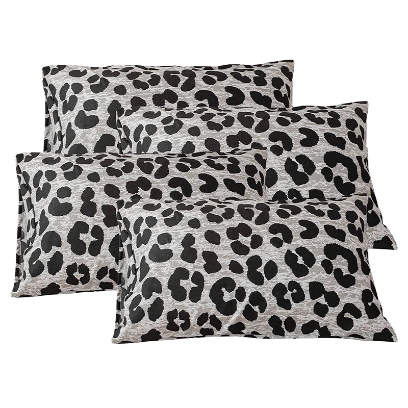 A set of two leopard print decorative pillow covers in gray and black spots.