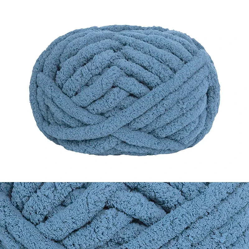 A ball of hand-knitted wool finger line scarf in light blue color.
