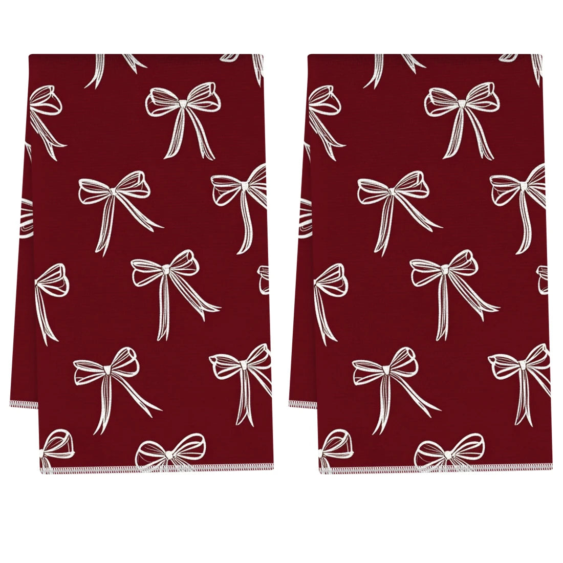 A pair of deep red kitchen towels with white bow patterns.