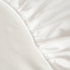 White soft touch microfiber fitted sheet with gathered elastic waistband