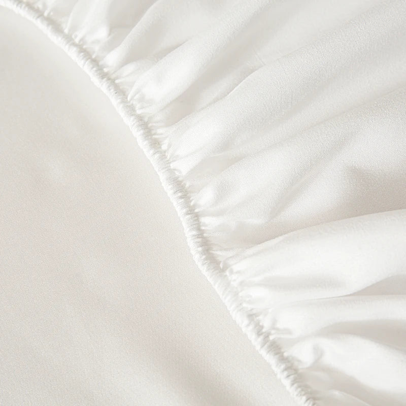 White soft touch microfiber fitted sheet with gathered elastic waistband