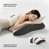 A woman is relaxing on a multifunctional prone pillow bed essential designed for full body relaxation.