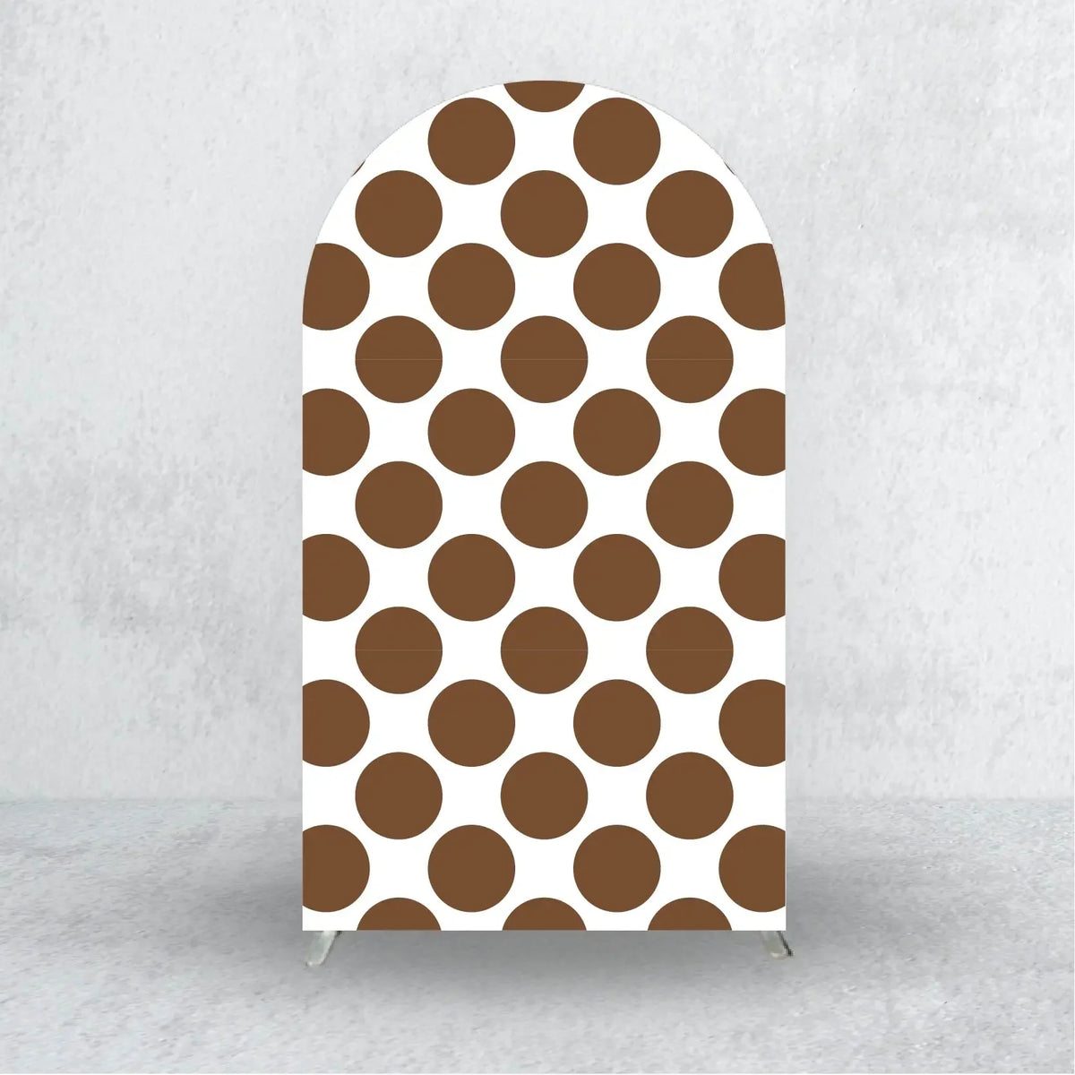 A tall arch backdrop cover featuring a repeating pattern of brown polka dots on a white background.